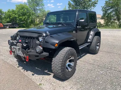 2009 wrangler 3.8 automatic transmission power windows AC winter tires and rims,spare tire rack with...