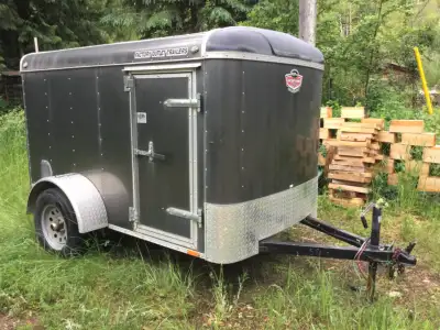 Cargo Mate with brakes, very good condition. Clean, dry, and securable. Nice unit, holds a ton.