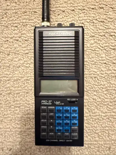 For sale is a Realistic PRO-37 scanner, a handheld device known for its 200-channel direct entry cap...