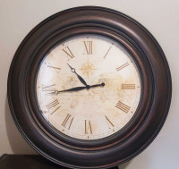 Roman numeral wall clock 30" in diameter.  Like new!