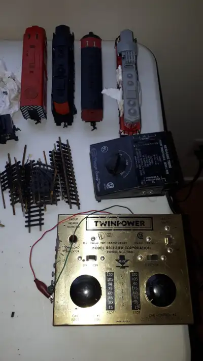 lots and lots of pieces, 38 box cars 4 cabooses, 7 CP 1405 locomotive, 6 passenger cars, 2 cn dome c...