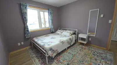 Private ground-floor bedroom with private washroom in two-story owner-occupied home. Rent includes a...