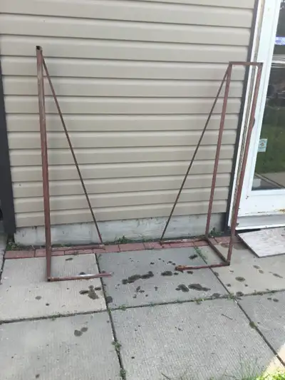 Metal frame firewood racks, can be adjusted to desired lengths, very sturdy in good condition, 57 in...