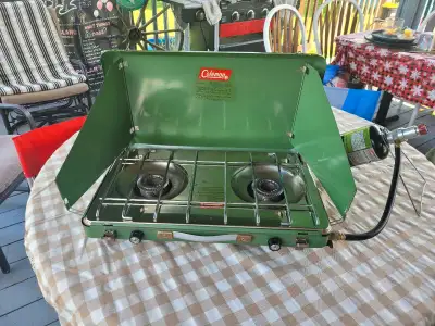 This is a used Coleman camping stove with two burners, perfect for your outdoor cooking needs! It's...