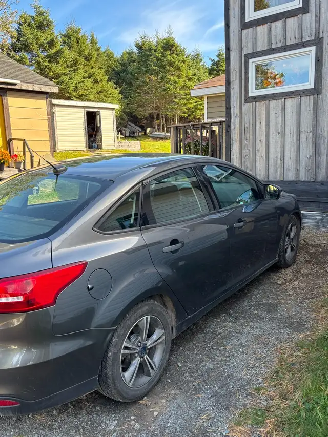 Ford Focus it has 4 studded winter tires on rims goes with it in Cars & Trucks in Cape Breton - Image 6
