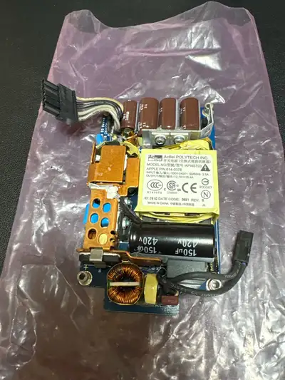 This is an original AcBel Polytech Inc. internal power supply unit, model API4ST03 (Apple P/N 614-03...