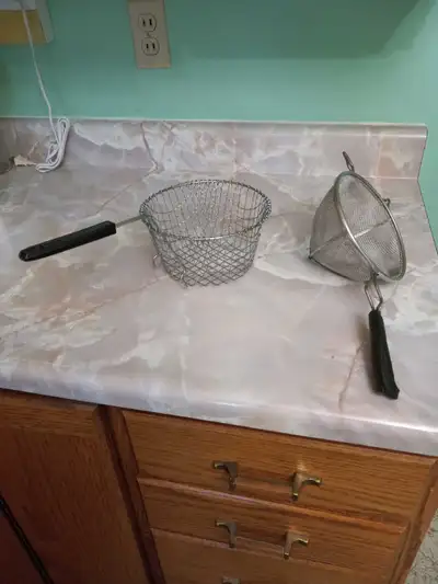 Antique Metal strainer and regular fryer lifter, View more