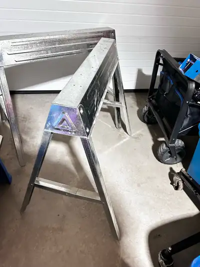 2 Compartment Folding Steel Sawhorses, used good condition, View more
