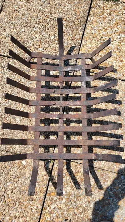 This is a sturdy, used fireplace grate perfect for keeping your logs organized and the fire burning...