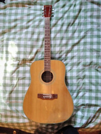 Left-handed Crestwood acoustic guitar