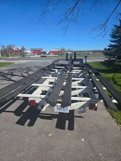 I have a bunk tri toon trailer for rent or I can pick up and deliver your boat for you or move it fr...