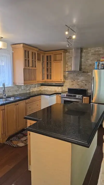 Kitchen cabinets for sale. Comes with island, countertops and sink/faucet Pick up location: Kipling...