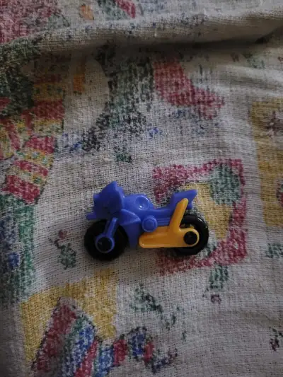 Kinder Surprise motorcycle toy, specifically a blue and yellow , View more