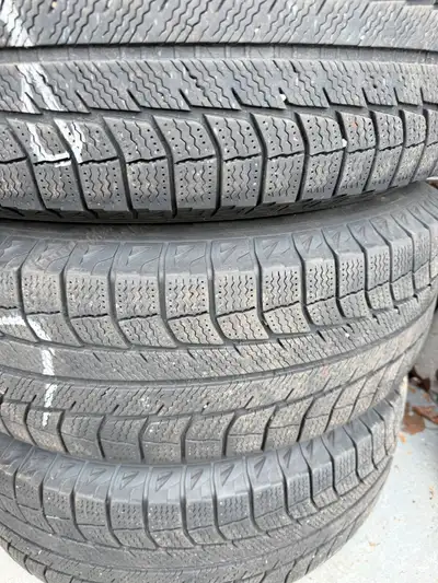 Set of four Michelin X-Ice winter tires, size 225/70R16. All mounted on 5x114.3 steel rims with a 5-...
