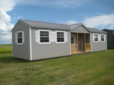 BRAND NEW 12x40 Cabin/Shed Front center deck/porch, dormer roof, walk in door and 6 windows. Awesome...