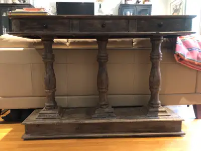 Nice console/sofa table solid wood with 3 turned legs, in perfect condition. 3 storage drawers. Heav...