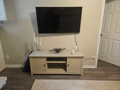 54 x 23 media console. In good condition. Painted in chalk paint. Has Storage.