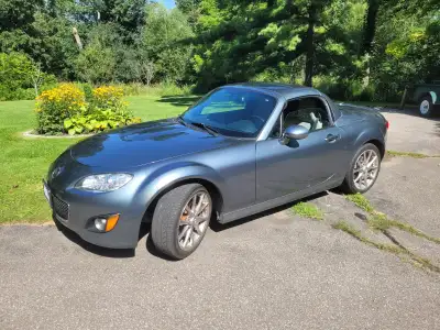 Limited edition retractable hard top. One of 750 made in Dolphin Grey with white leather interior. S...