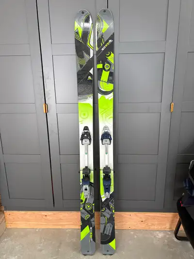 Get ready for adventure with these K2 Sidestash skis including touring binding and skins, measuring...