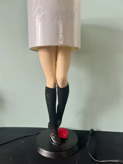 S exy vintage leg lamp in high heels and pantyhose. Beautiful bright rose flower. The lamp is functi...
