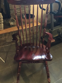 SOLID wood mahogany rocking chair.  