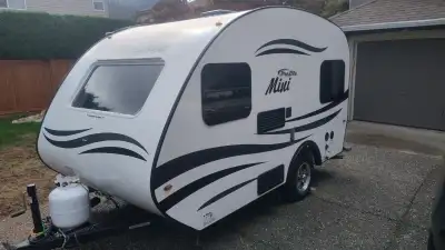 An ultra-light travel trailer (1150 lbs), easy to pull with a small SUV, minivan etc. Well-cared for...