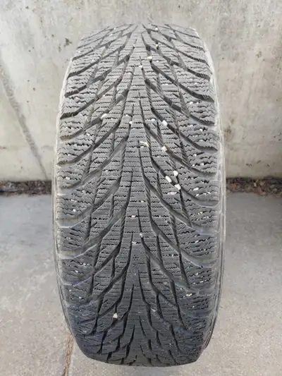 One Nokian winter tire and One Falken all season tire with rim. Winter tire size 195/60R15 , All sea...
