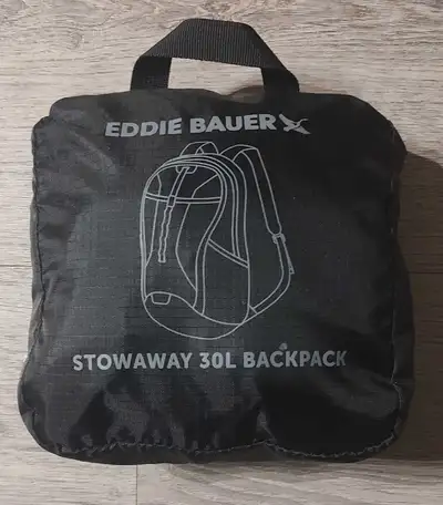 This is an Eddie Bauer Stowaway 30L Backpack in excellent used condition, ready for your next advent...