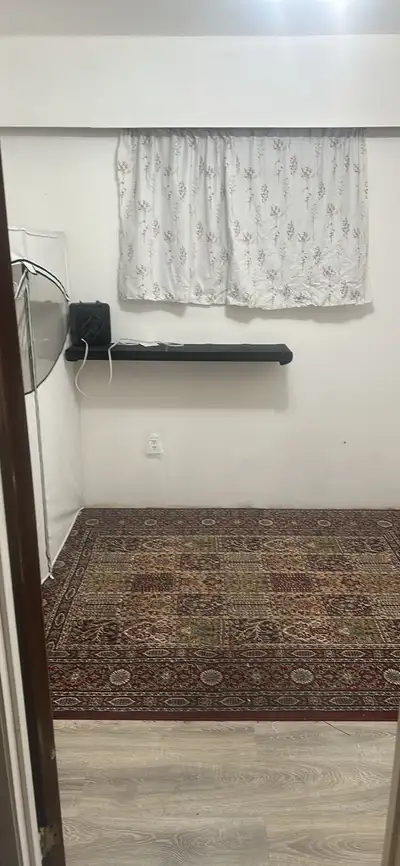 This clean and cozy furnished bedroom is available for rent, providing a comfortable space with a la...