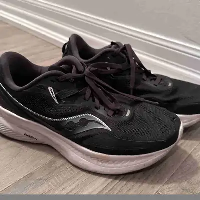 Black Saucony running shoes, View more