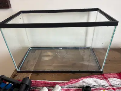 10 gallon fish tank -filter -2 lights -heater -gravel vaccuum -decorations -gravel NO LID