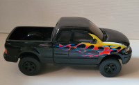 ERTL Diecast Chevy Black Truck with Red, Yellow & Blue Flames