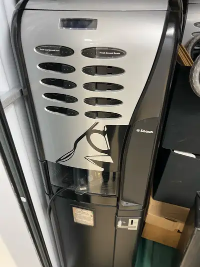 Selling a used Saeco SG200 coffee vending machine, capable of dispensing fresh ground coffee. A perf...