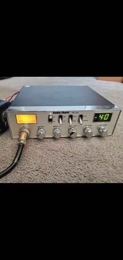 Realistic TRC-444 CB radio with microphone, a classic piece of communication technology. This unit f...