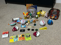 Various Pokémon items with one new unopened Pokémon toy