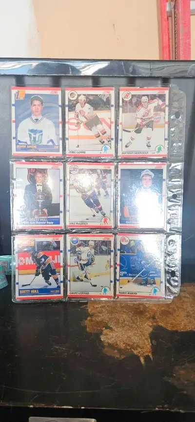 I'm offering a collection of used Score hockey cards, neatly organized in plastic sleeves. These car...