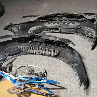These two automotive front bumpers are available for sale and show clear signs of wear and tear, ind...