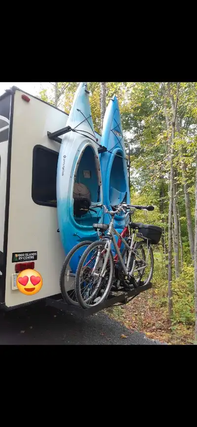 Custom kayak carrier system for RV. Holds two kayaks and two bicycles. Built on a standard cargo rac...