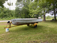 16" CRESTLINER BOAT WITH 20 H.P JOHNSON MOTOR AND TRAILER