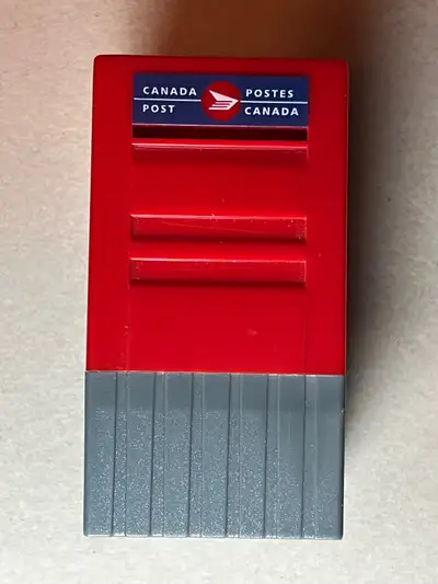 This miniature Canada Post mailbox is not just a charming collectible; it's also a stamp holder! Thi...