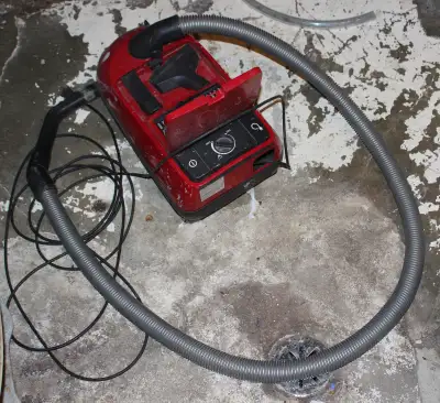 Takes FJM bags, no wand, original hose, cord re-coiler removed, motor works and wired directly to co...