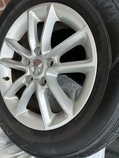 Original dodge caravan 2016 rims Used only 3 years perfect condition like new sensor included tires...
