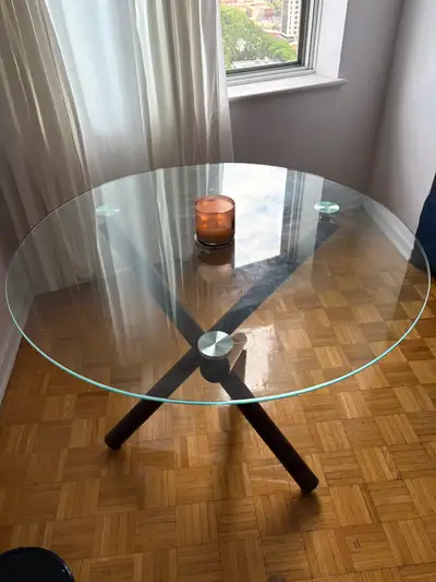 Brown table with glass top.