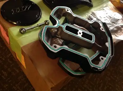 black gloss head spacers, SE 55mm throttle body, oil pump/cam plate, 117 derby cover, stock shifter...