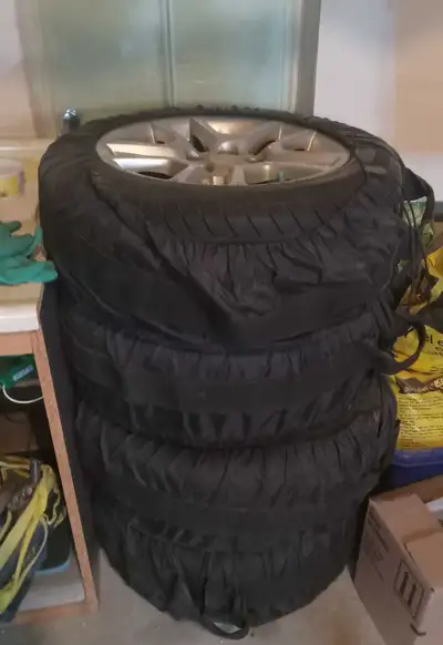 A set of 4 summer tires with tire covers. Tires were used for only 1 season and are in like new cond...
