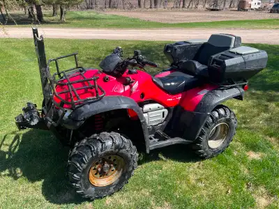 2005 Honda 400 automatic/electric shift and select 2wd or 4wd. Has winch, 2up seat with storage, 60”...