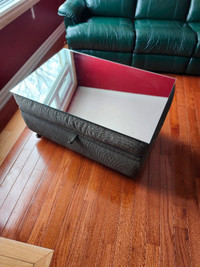 FABRIC OTTOMAN currently used as a mirrored coffee table