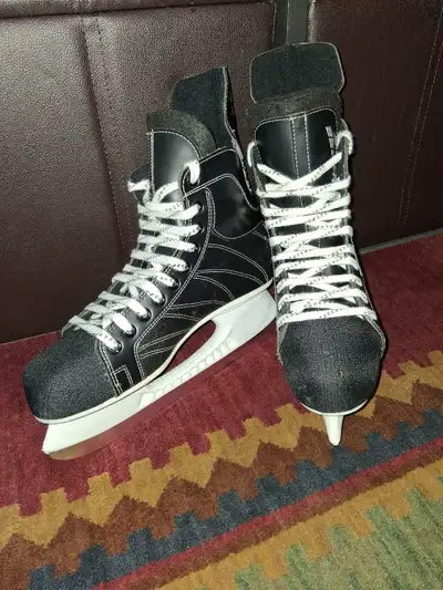 Get ready to glide on the ice with these Bauer Supreme ice skates! These skates are in used conditio...