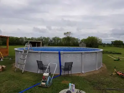 27 foot Galaxy pool. Comes with pump and filter. One new filter and 2 used. Has ladder and pool clea...
