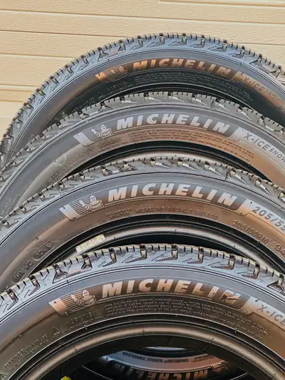 These set of four pre-owned Michelin X-Ice Snow tires in size 205/55R16 are designed for superior wi...